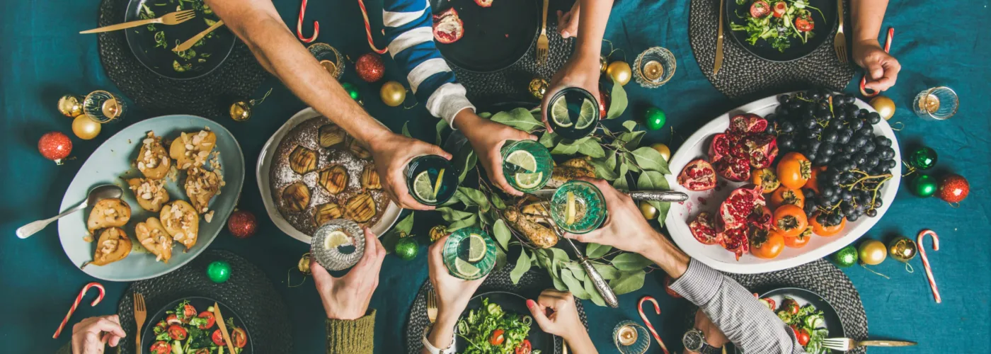 company of friends gathering for christmas dinner U5DXMK4 scaled jpg